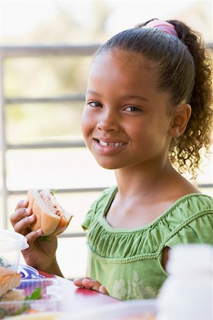photos kids eating daycare - Girl eating lunch at kindergarten Stock Photo - Budget Royalty-Free & Subscription, Code: 400-04037876