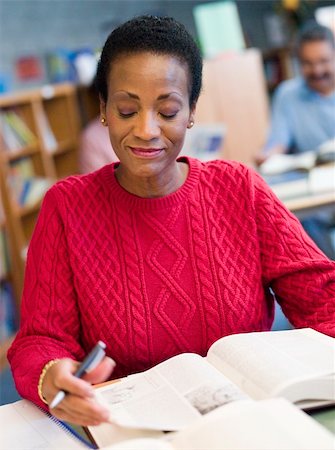 Mature female student studying in library Stock Photo - Budget Royalty-Free & Subscription, Code: 400-04037905