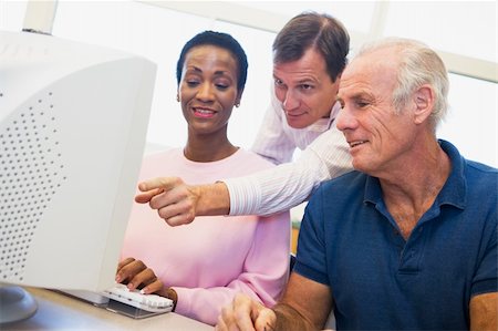 Mature students learning computer skills Stock Photo - Budget Royalty-Free & Subscription, Code: 400-04037978