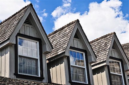 dormir - Window dormers on a house with wooden shingles on blue sky background Stock Photo - Budget Royalty-Free & Subscription, Code: 400-04038135