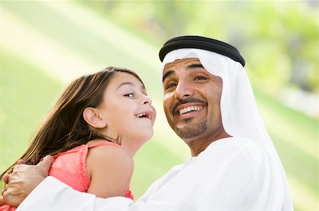 simsearch:400-04038226,k - A Middle Eastern man and his daughter sitting in a park Foto de stock - Super Valor sin royalties y Suscripción, Código: 400-04038217