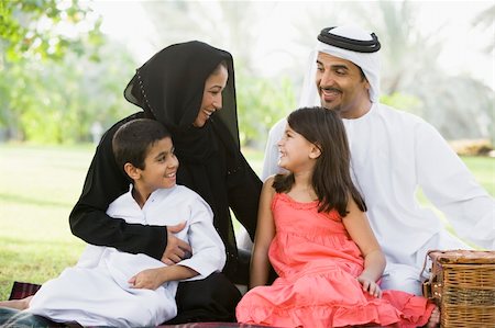 A Middle Eastern family sitting in a park Stock Photo - Budget Royalty-Free & Subscription, Code: 400-04038223