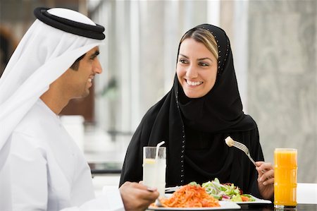 A Middle Eastern couple enjoying a meal in a restaurant Stock Photo - Budget Royalty-Free & Subscription, Code: 400-04038233