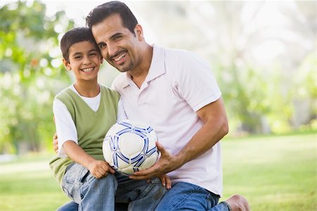 Father and son playing football together Stock Photo - Budget Royalty-Free & Subscription, Code: 400-04038344