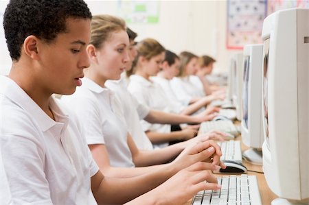 simsearch:6110-06702683,k - Row of schoolchildren studying in front of a computer Stock Photo - Budget Royalty-Free & Subscription, Code: 400-04038535