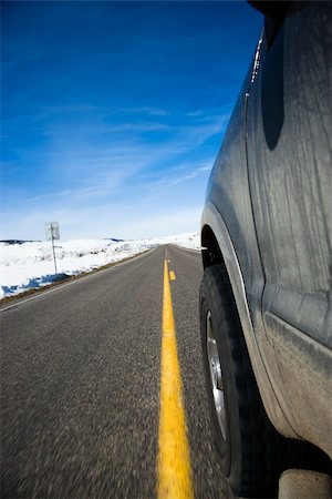 Perspective shot of SUV driving down road in snowy Colorado during winter. Stock Photo - Budget Royalty-Free & Subscription, Code: 400-04039494