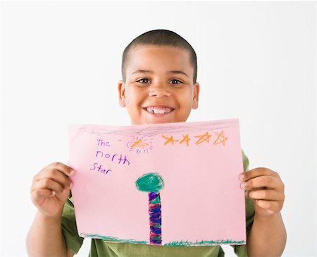 papier de bricolage - Young boy proudly showing drawing. Photographie de stock - Aubaine LD & Abonnement, Code: 400-04039715