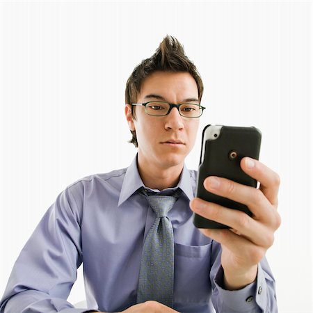 simsearch:400-04186486,k - Asian businessman with serious expression looking at his pda cellphone. Stock Photo - Budget Royalty-Free & Subscription, Code: 400-04039916