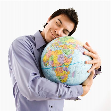 Young Asian man holding globe with happy expression on his face. Stock Photo - Budget Royalty-Free & Subscription, Code: 400-04039938