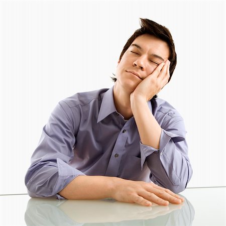simsearch:400-04186486,k - Young Asian business man sitting resting his eyes. Stock Photo - Budget Royalty-Free & Subscription, Code: 400-04039940