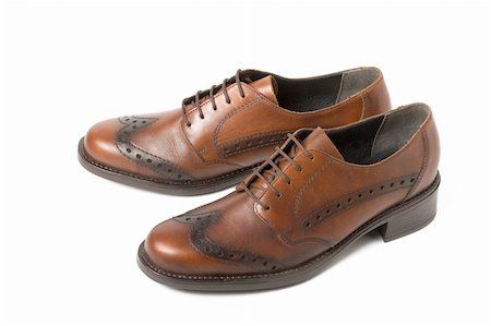 simsearch:400-05317494,k - Two brown shoes isolated on white background Foto de stock - Super Valor sin royalties y Suscripción, Código: 400-04030661