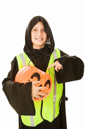 Adorable little boy in his halloween costume, wearing a reflective vest for safe trick or treating.    Isolated on white. Stock Photo - Budget Royalty-Free & Subscription, Code: 400-04031213