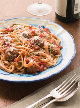 simsearch:400-04031652,k - Plate of Spaghetti Meatballs in Tomato sauce with Parmesan with cutlery and wine Stock Photo - Budget Royalty-Free & Subscription, Code: 400-04031408