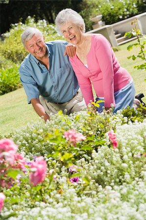 Senior couple working in garden flowerbed Stock Photo - Budget Royalty-Free & Subscription, Code: 400-04031428