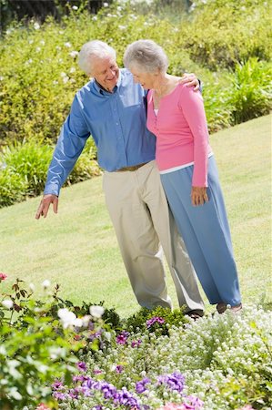 simsearch:400-05314664,k - Senior couple in garden admiring flowerbed Stock Photo - Budget Royalty-Free & Subscription, Code: 400-04031435