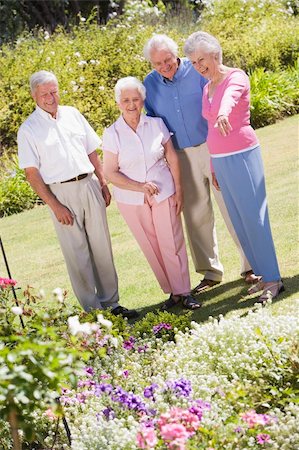 retirement home group - Group of senior friends in garden admiring flowerbeds Stock Photo - Budget Royalty-Free & Subscription, Code: 400-04031432