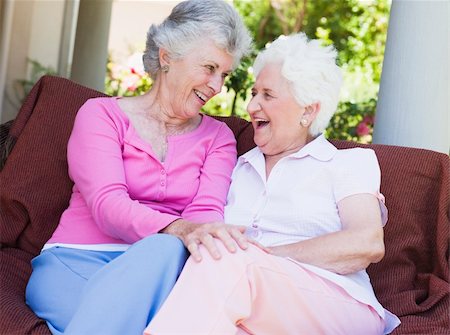 simsearch:400-05314664,k - Senior female friends chatting together sitting on garden seat Stock Photo - Budget Royalty-Free & Subscription, Code: 400-04031447