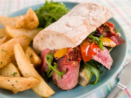 simsearch:400-04031652,k - Plate of Steak and Roasted Pepper Ciabatta Sandwich with Spiced Potato Wedges Stock Photo - Budget Royalty-Free & Subscription, Code: 400-04031502