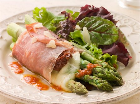 roasted ham - Plate of Roasted Asparagus spears with Mozzarella Cheese and Sun Dried Tomatoes wrapped in Prosciutto Stock Photo - Budget Royalty-Free & Subscription, Code: 400-04031512