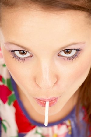 Young women with a lollipop close up Stock Photo - Budget Royalty-Free & Subscription, Code: 400-04031862