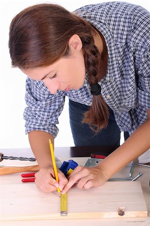 female builders carpentry - woman carpenter at work on white background Photographie de stock - Aubaine LD & Abonnement, Code: 400-04032095