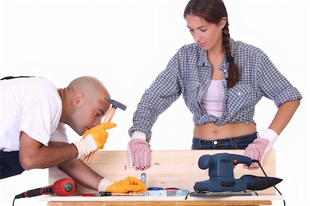 female builders carpentry - construction workers at work on white background Stock Photo - Budget Royalty-Free & Subscription, Code: 400-04032093