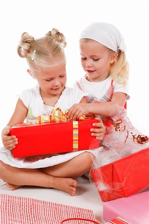two cute girls celebrating special occasion, unpacking gifts together Photographie de stock - Aubaine LD & Abonnement, Code: 400-04032116