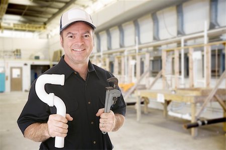 Plumber standing in the plumbing workshop of an industrial trade school. Stock Photo - Budget Royalty-Free & Subscription, Code: 400-04032938