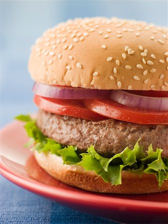 simsearch:614-06813733,k - Beef Burger in a Sesame Seed Bun Stock Photo - Budget Royalty-Free & Subscription, Code: 400-04033591