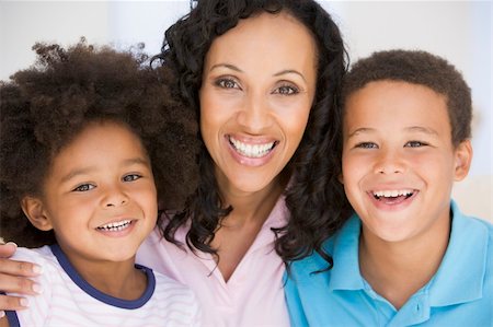 Woman and two young children smiling Stock Photo - Budget Royalty-Free & Subscription, Code: 400-04044012