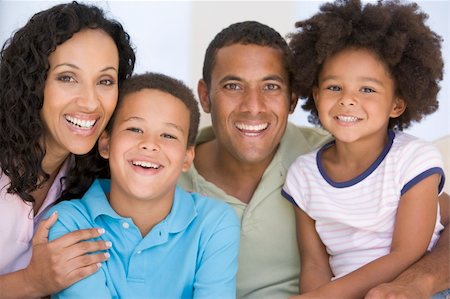 Family in living room smiling Stock Photo - Budget Royalty-Free & Subscription, Code: 400-04044013