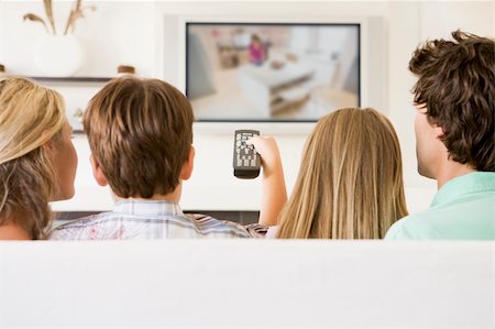 simsearch:400-04045202,k - Family in living room with remote control and flat screen televi Stock Photo - Budget Royalty-Free & Subscription, Code: 400-04044046