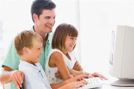 simsearch:400-04044108,k - Man and two young children in home office with computer smiling Stock Photo - Budget Royalty-Free & Subscription, Code: 400-04044065