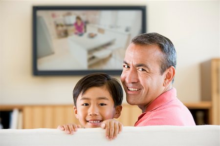 simsearch:400-04045202,k - Man and young boy in living room with flat screen television smi Stock Photo - Budget Royalty-Free & Subscription, Code: 400-04044090