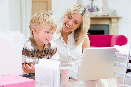 simsearch:400-04044122,k - Woman and young boy in home office with laptop smiling Stock Photo - Budget Royalty-Free & Subscription, Code: 400-04044111