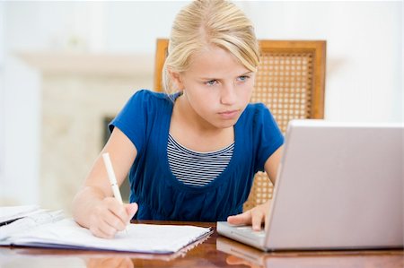 simsearch:400-04044137,k - Young girl with laptop doing homework in dining room Stock Photo - Budget Royalty-Free & Subscription, Code: 400-04044137