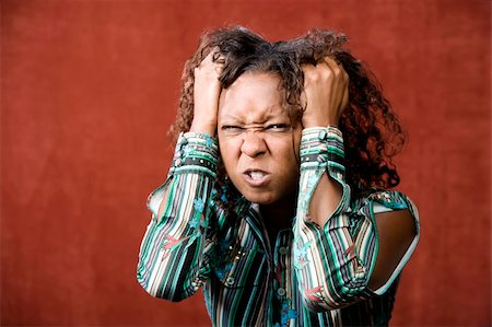 simsearch:400-07681479,k - Close-Up Portrait of an Angry African-American Woman Stock Photo - Budget Royalty-Free & Subscription, Code: 400-04044184