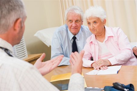 elderly couple concern - Couple in doctor's office frowning Stock Photo - Budget Royalty-Free & Subscription, Code: 400-04044226