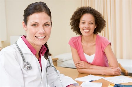 simsearch:400-04021788,k - Woman in doctor's office smiling Stock Photo - Budget Royalty-Free & Subscription, Code: 400-04044247
