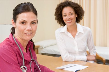 simsearch:400-04021788,k - Woman in doctor's office smiling Stock Photo - Budget Royalty-Free & Subscription, Code: 400-04044243