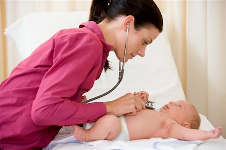 simsearch:400-08935984,k - Doctor giving checkup with stethoscope to baby in exam room Stock Photo - Budget Royalty-Free & Subscription, Code: 400-04044307