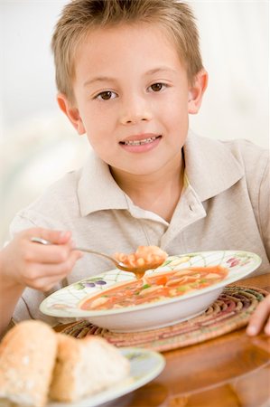 simsearch:400-04044645,k - Young boy indoors eating soup Photographie de stock - Aubaine LD & Abonnement, Code: 400-04044763