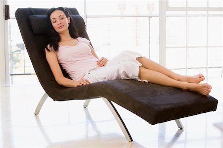 picture of lady on sleeping lounge chair - Woman sitting in chair sleeping Stock Photo - Budget Royalty-Free & Subscription, Code: 400-04045191