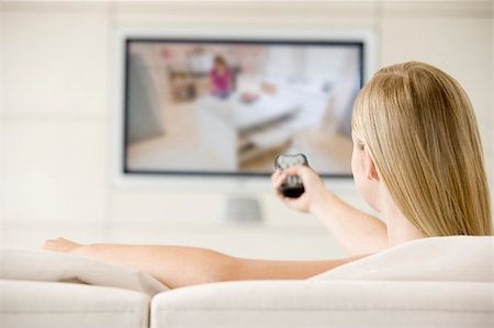 simsearch:400-04045202,k - Woman in living room watching television Stock Photo - Budget Royalty-Free & Subscription, Code: 400-04045208