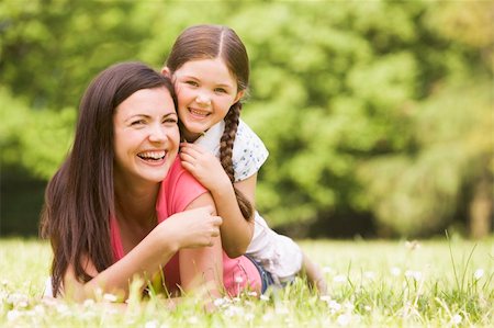 simsearch:400-04046012,k - Mother and daughter lying outdoors smiling Stockbilder - Microstock & Abonnement, Bildnummer: 400-04045408
