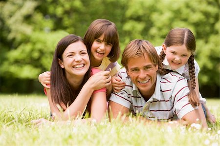 simsearch:400-04043055,k - Family outdoors smiling Stock Photo - Budget Royalty-Free & Subscription, Code: 400-04045427