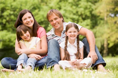 simsearch:400-04043055,k - Family outdoors smiling Stock Photo - Budget Royalty-Free & Subscription, Code: 400-04045428