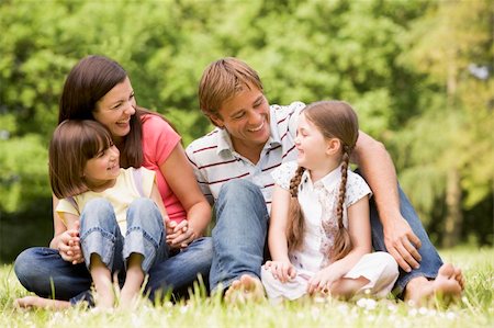 simsearch:400-04043055,k - Family outdoors smiling Stock Photo - Budget Royalty-Free & Subscription, Code: 400-04045429