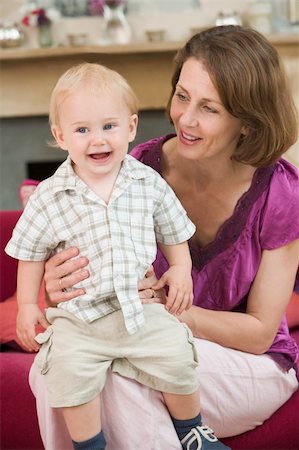 simsearch:400-04045907,k - Mother in living room with baby smiling Stock Photo - Budget Royalty-Free & Subscription, Code: 400-04045810