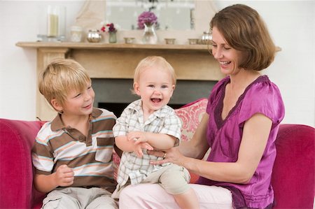 simsearch:400-04045907,k - Mother in living room with baby and young boy smiling Stock Photo - Budget Royalty-Free & Subscription, Code: 400-04045812